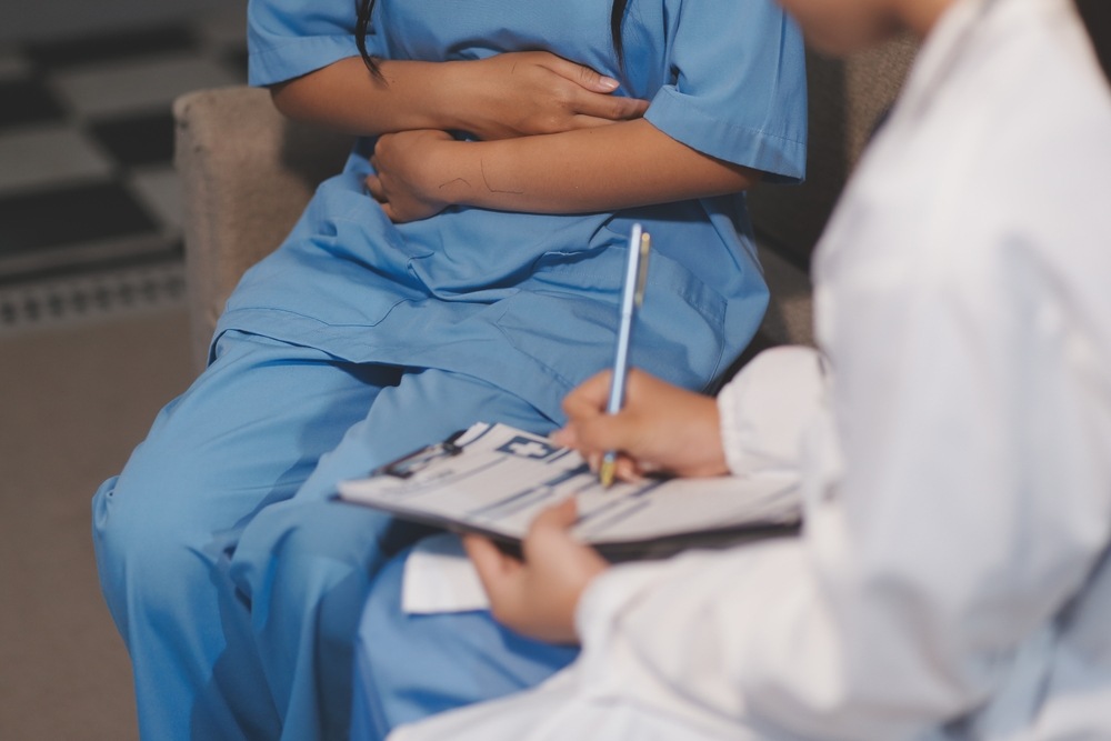 Parent consulting a doctor about signs of birth injury in a Maryland newborn